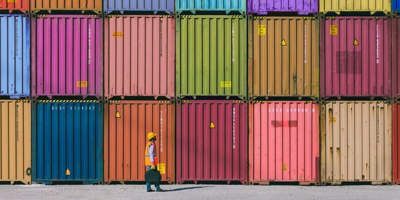Maintanence worker working with cargo containers